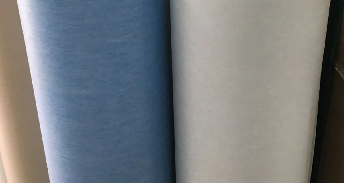 Blue and white fibrous motor insulation laminate rolls close-up